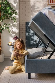 Modrá boxspring posteľ s úložným priestorom 180x200 cm Elva Bold Line – Bonami Selection