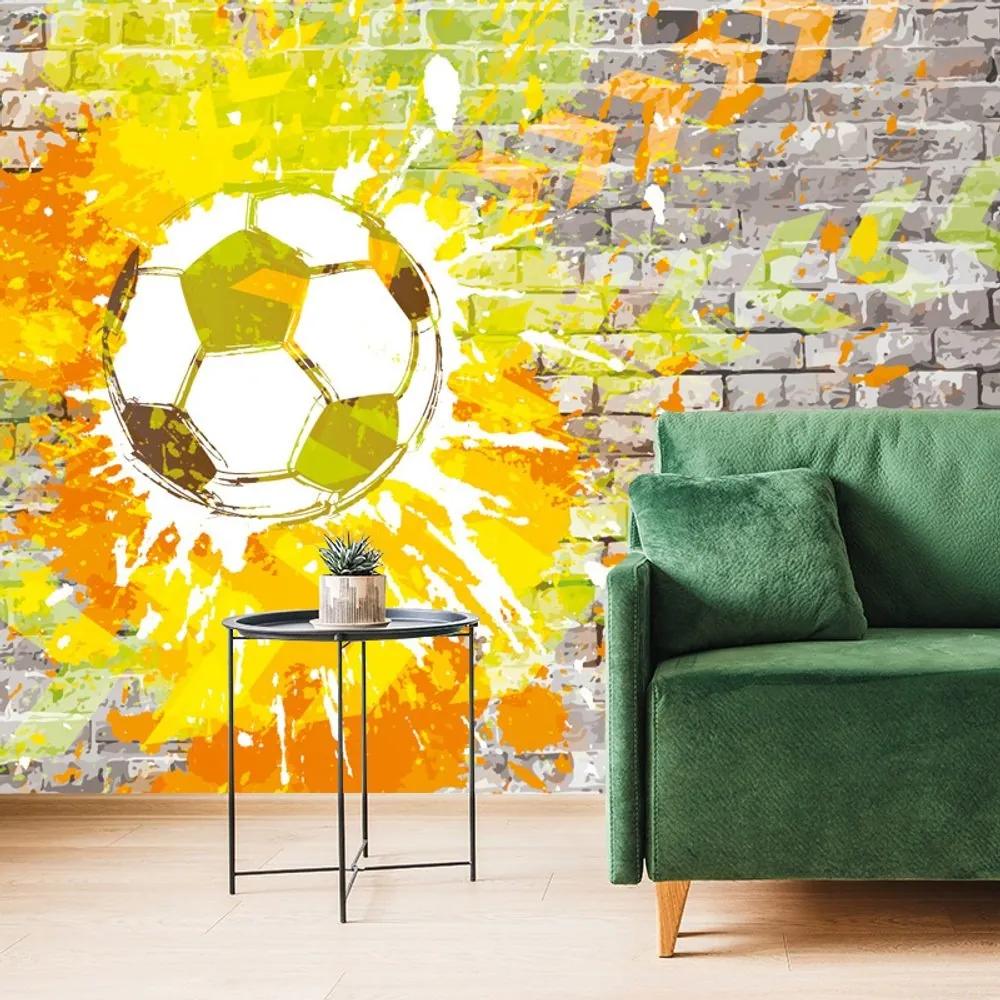 Tapeta futbalová lopta na tehlovej stene - 375x250