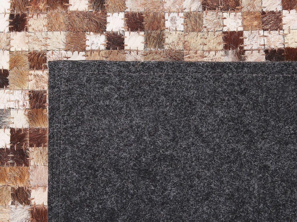 Kožený koberec 140 x 200 cm hnedá/béžová TORUL Beliani