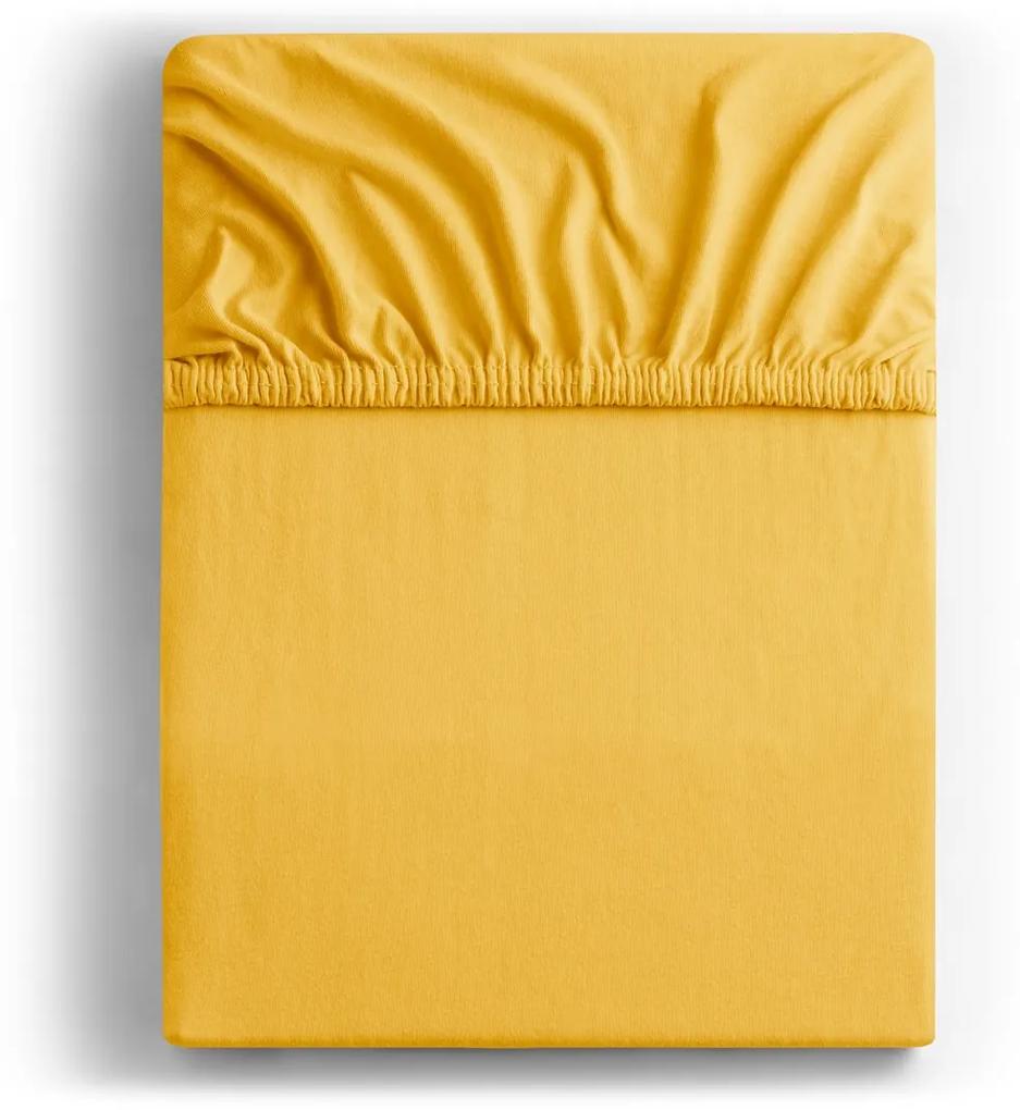 Bavlnené jersey prestieradlo s gumou DecoKing Nephrite žlté