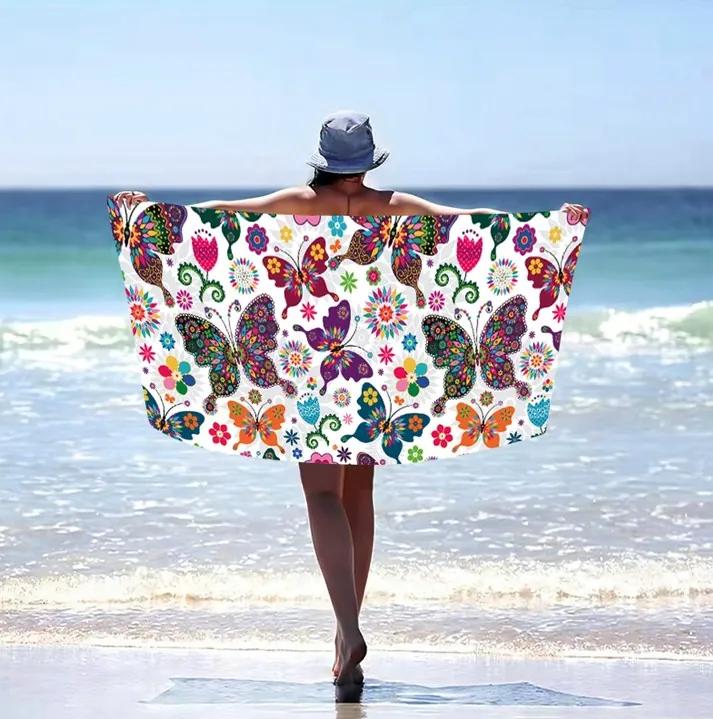 Plážová osuška s farebnými motýľmi