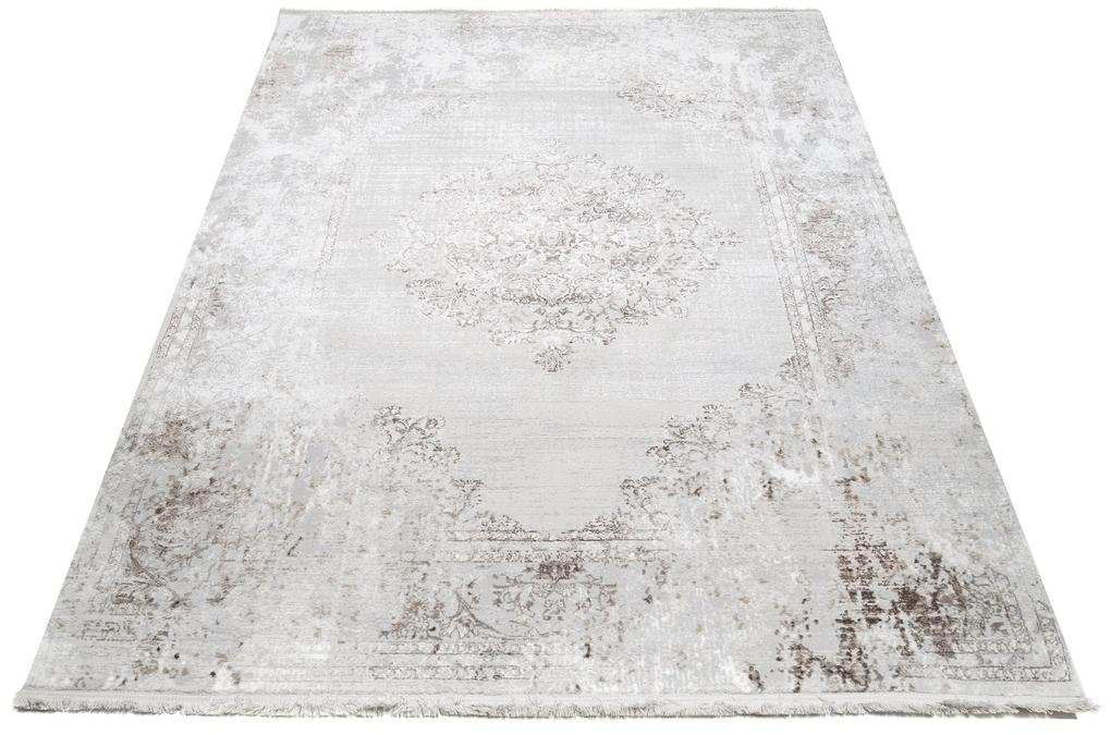 Svetlý krémovo-sivý dizajnový vintage koberec so vzormi