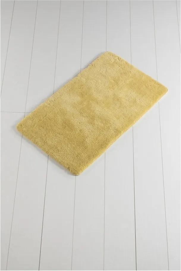 Žltá kúpeľňová predložka Minto Duratto, 100 × 60 cm