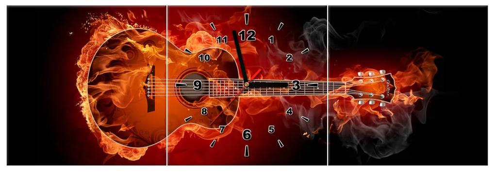 Gario Obraz s hodinami Horiaca gitara - 3 dielny Rozmery: 100 x 70 cm