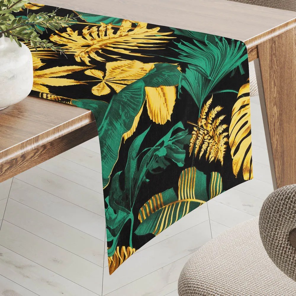 Biante Bavlnený behúň na stôl Sandra SA-603 Zeleno-zlaté tropické listy na čiernom 35x140 cm