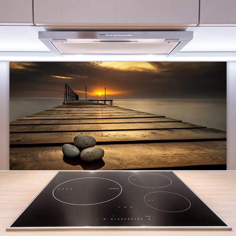 Sklenený obklad Do kuchyne More mólo západ slnka 125x50 cm