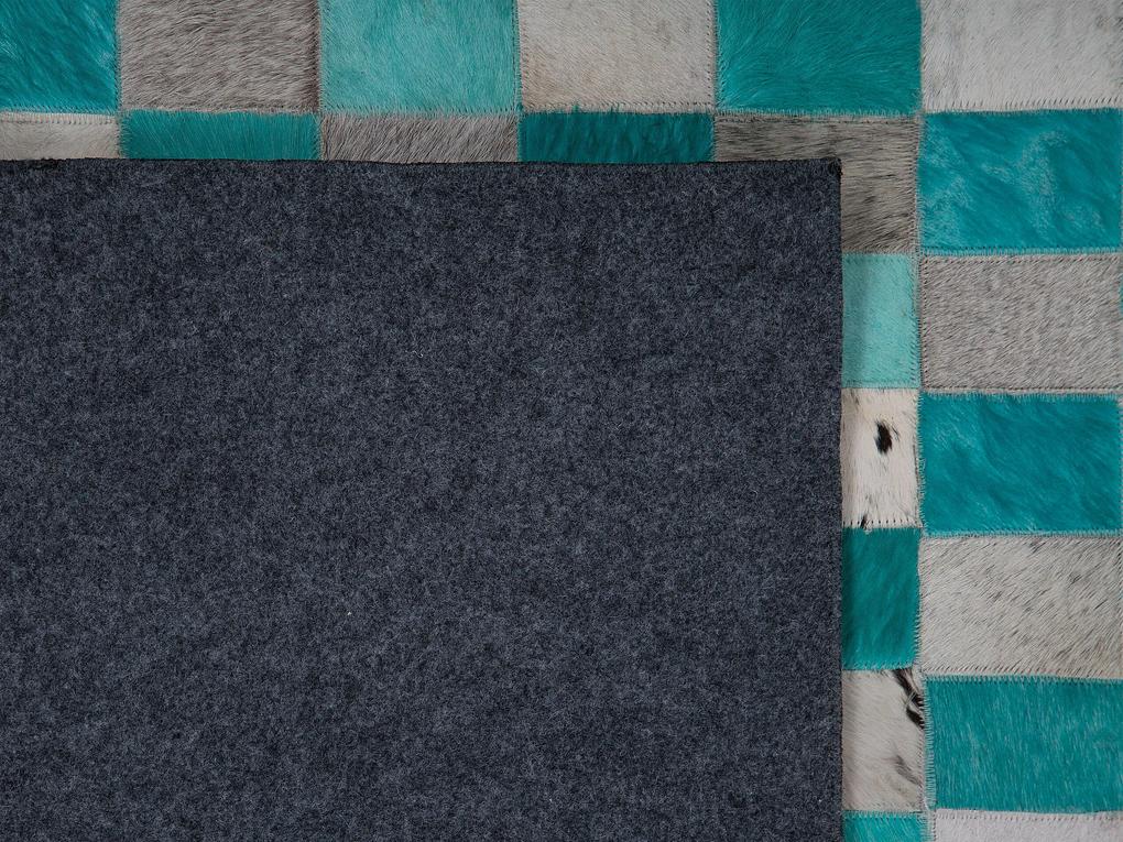Kožený koberec 160 x 230 cm tyrkysová/sivá NIKFER Beliani