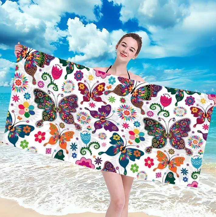 Plážová osuška s farebnými motýľmi