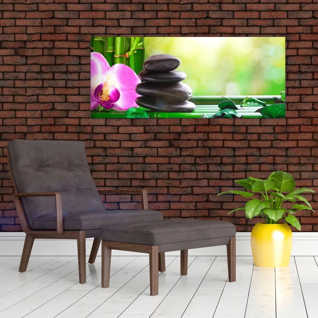 Obraz masážnych kameňov a orchidey na vode (120x50 cm)