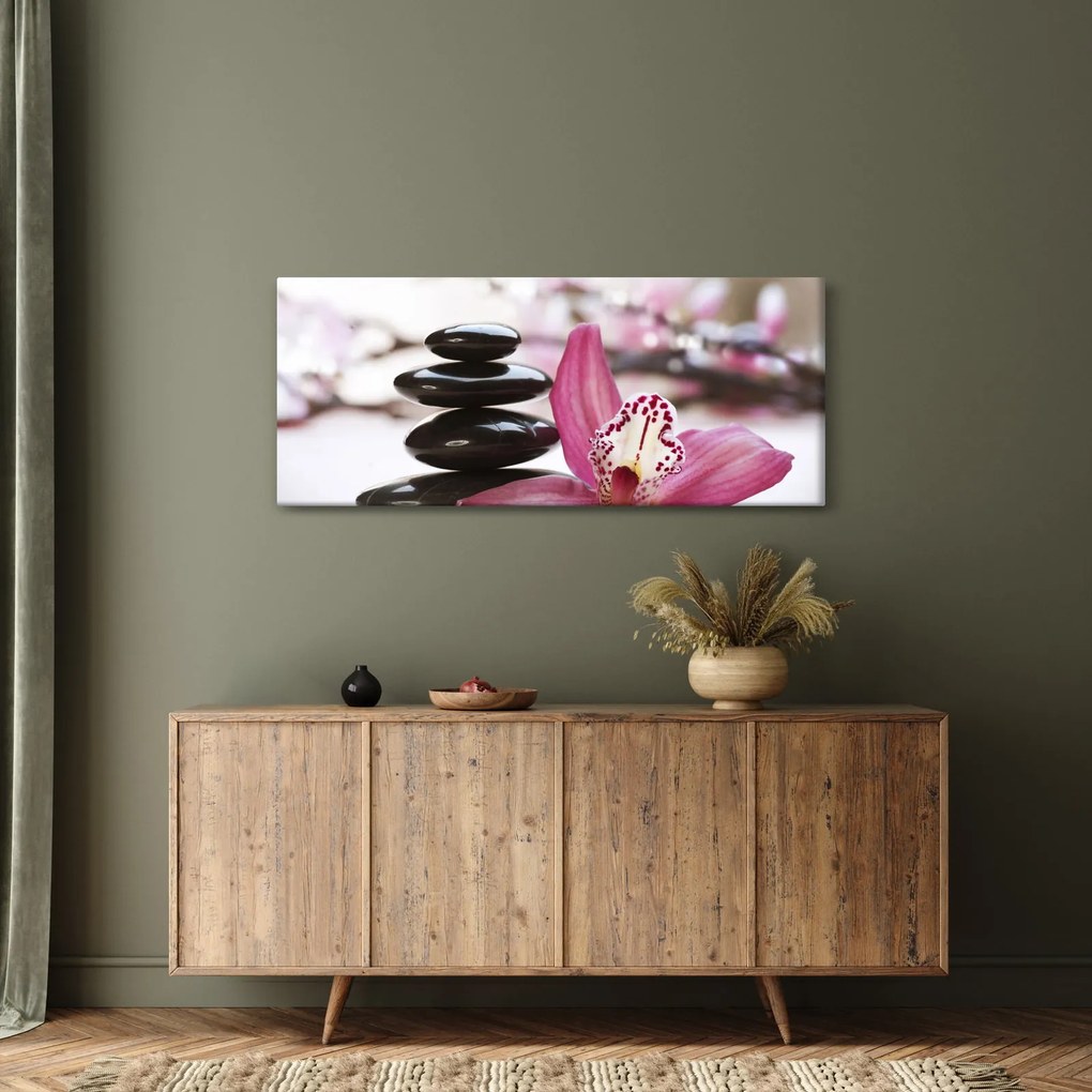 Obraz masážnych kameňov a orchidey na vode (120x50 cm)