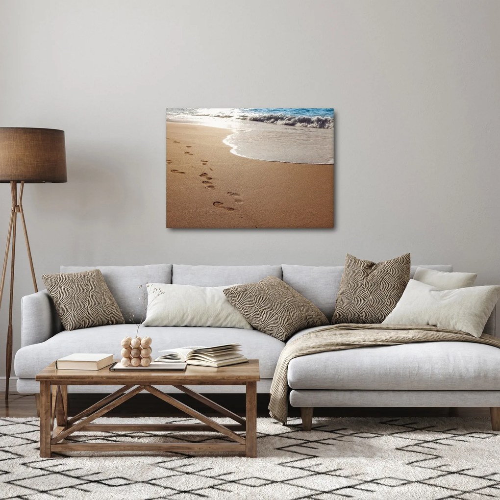 Obraz - stopy v piesku a more (70x50 cm)