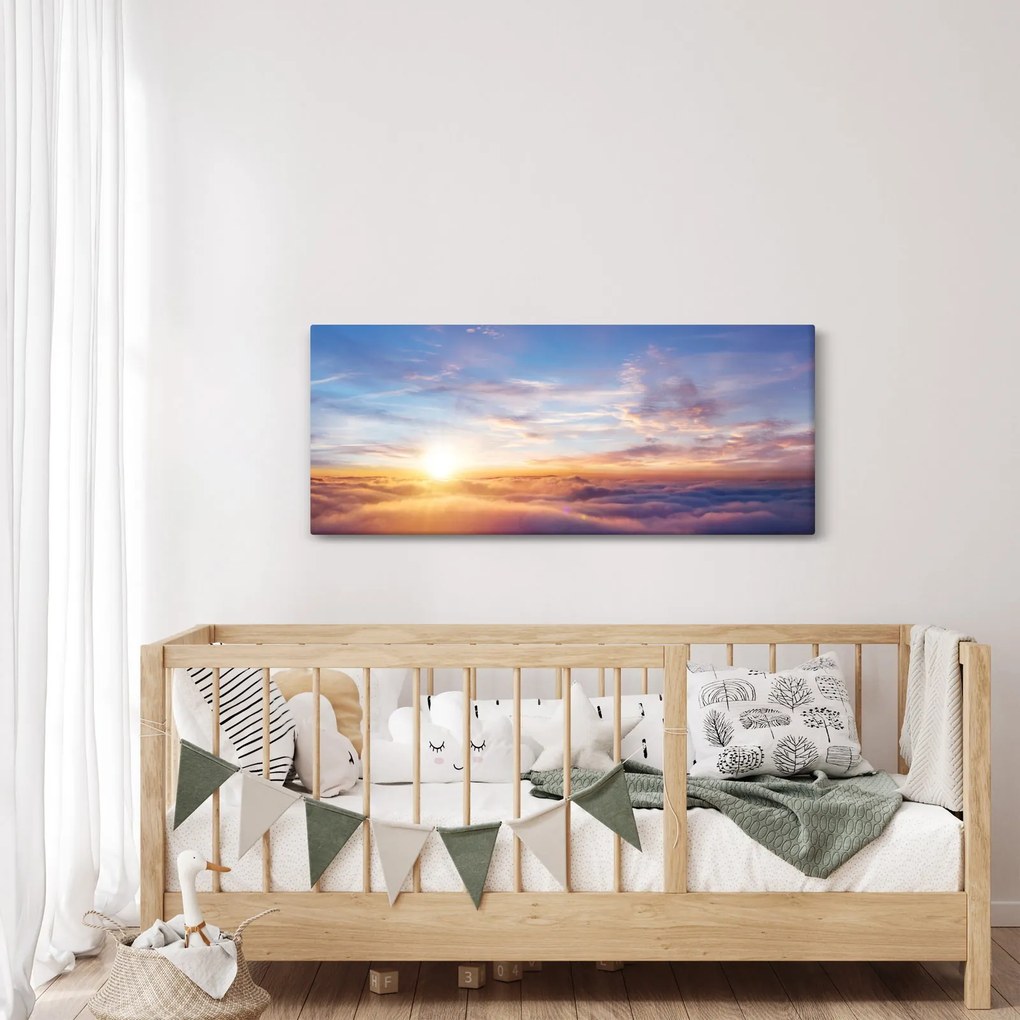Obraz - Západ slnka nad mrakmi (120x50 cm)