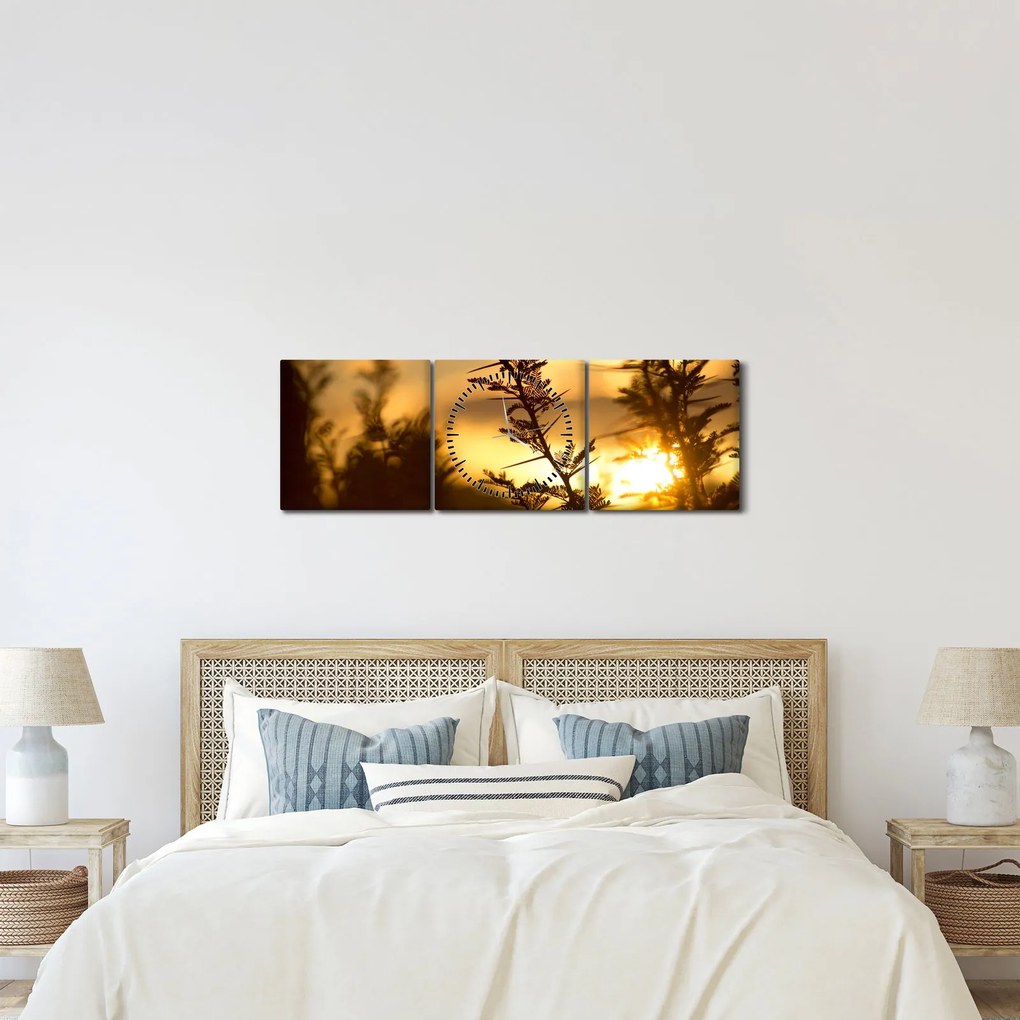 Obraz - Slnko zapadajúce za stromami (s hodinami) (90x30 cm)