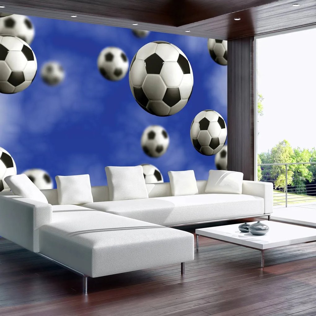 Fototapeta - Futbalové lopty na modrom pozadí (152,5x104 cm)