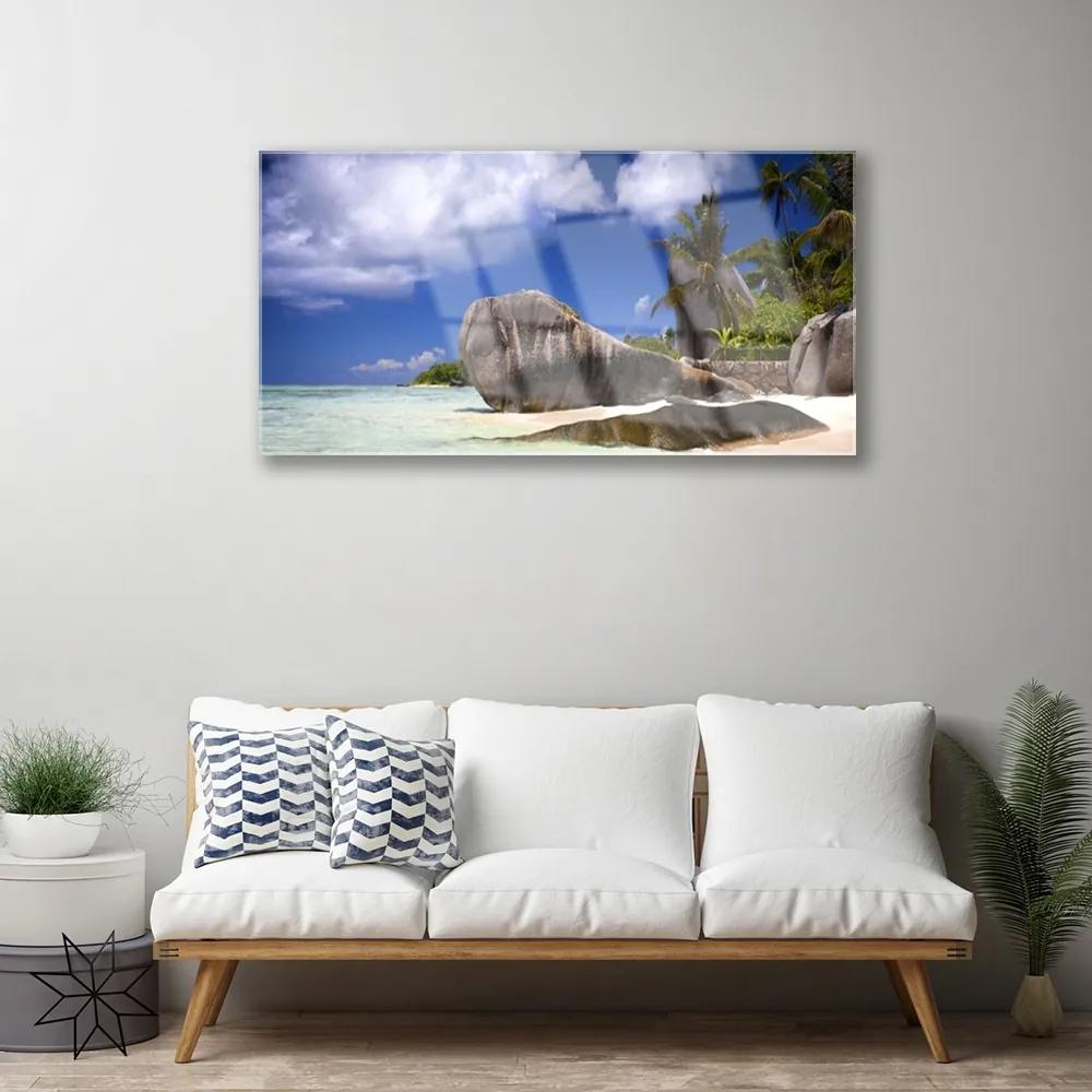 Obraz na skle Skaly pláž príroda 140x70 cm