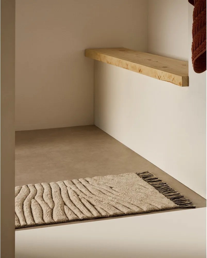 Béžová kúpeľňová predložka 50x70 cm Crilda – Kave Home