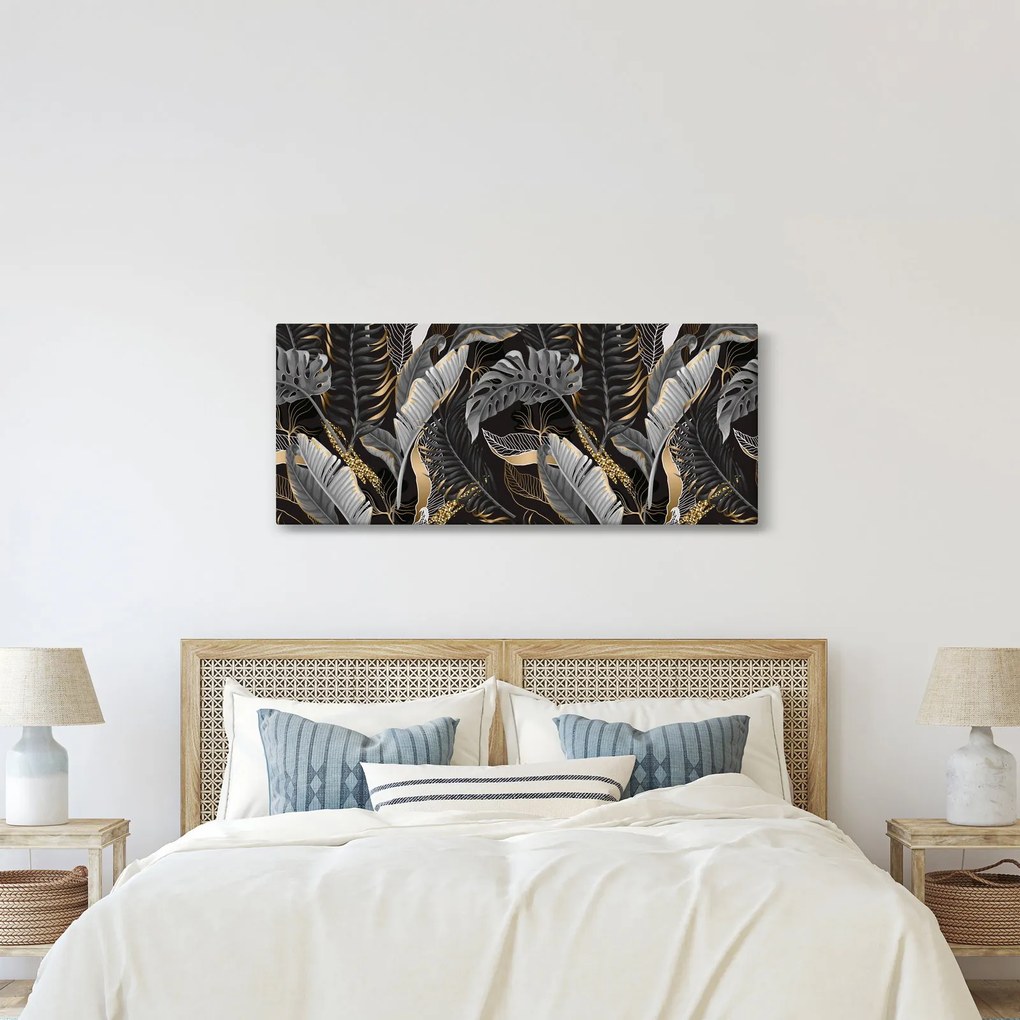 Obraz - Tropické listy v čierno-zlatej (120x50 cm)
