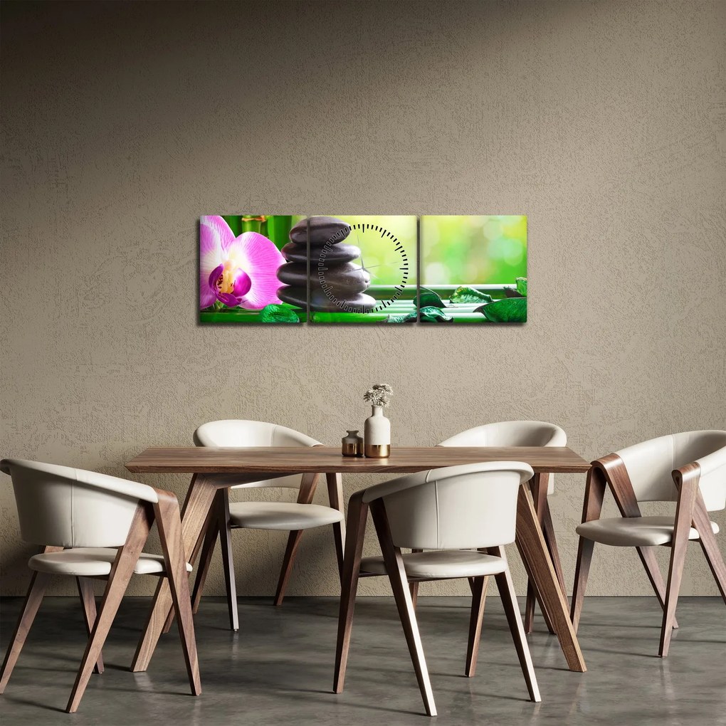 Obraz masážnych kameňov a orchidey na vode (s hodinami) (90x30 cm)