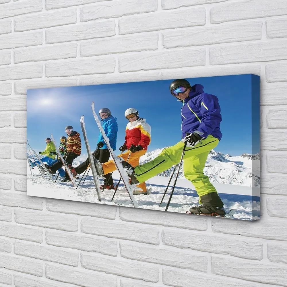 Obraz canvas Lyžiari zimné hory 120x60 cm