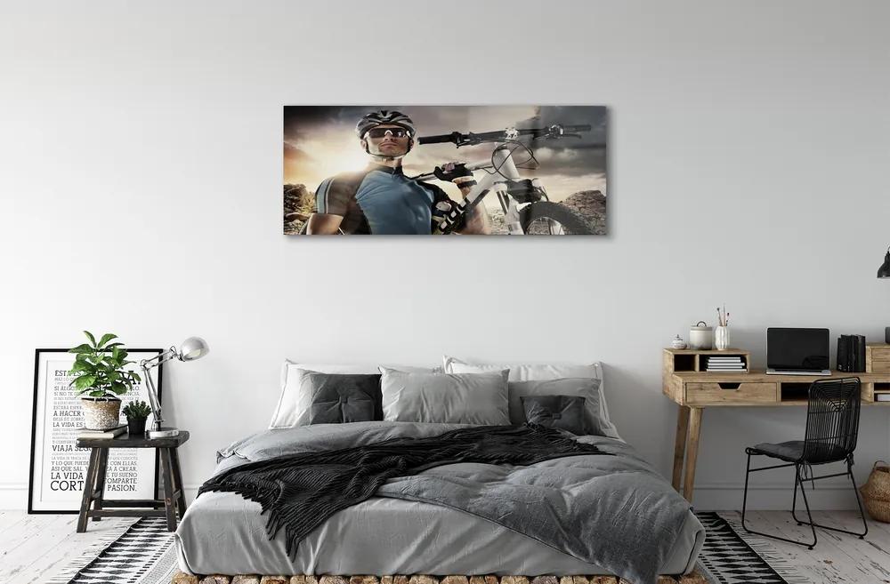 Obraz plexi Cyklista na bicykli mraky 120x60 cm