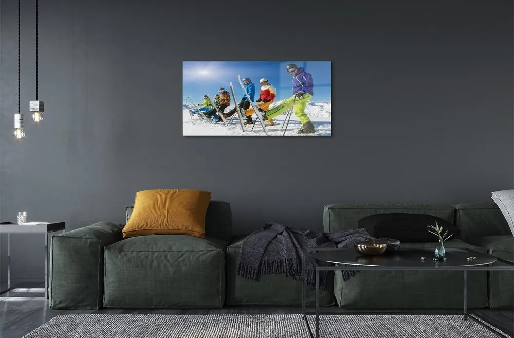 Obraz na skle Lyžiari zimné hory 125x50 cm