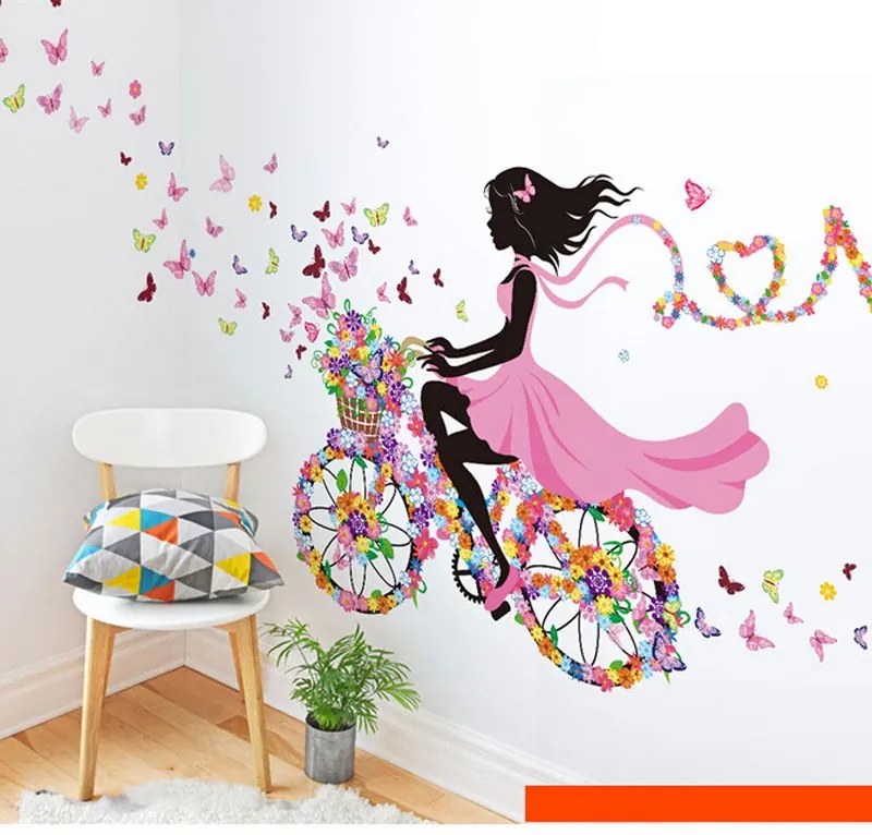 Samolepka na stenu "Dievča s motýľmi na bicykli" 140x70 cm