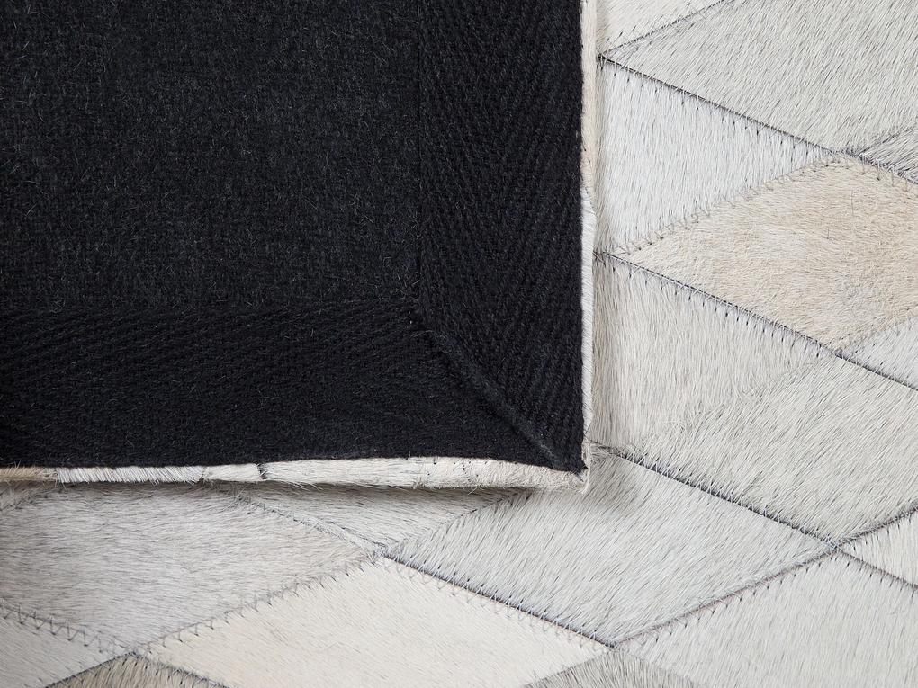 Kožený koberec 140 x 200 cm biela/čierna/béžová MALDAN Beliani