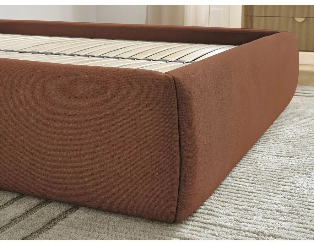 Oranžová čalúnená dvojlôžková posteľ s úložným priestorom/bez čela s roštom 180x200 cm Inera – Bobochic Paris