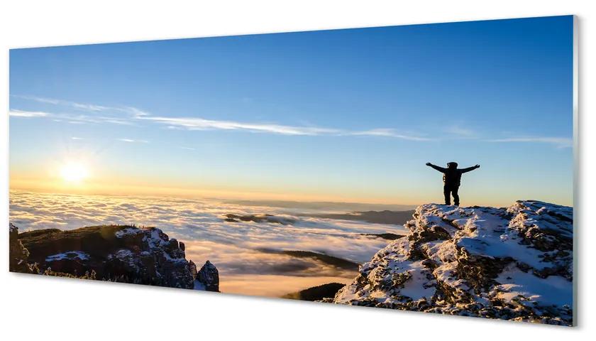 Obraz plexi Mountain muž mraky východ 120x60 cm