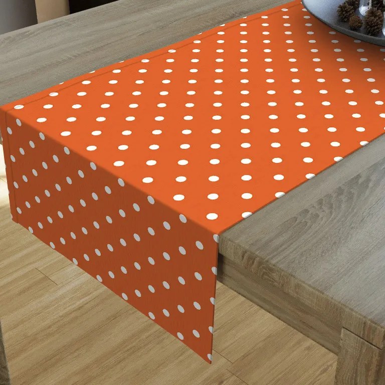 Goldea dekoračný behúň na stôl loneta - vzor biele bodky na oranžovom 20x120 cm