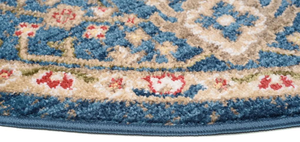 Okrúhly vintage koberec modrej farby