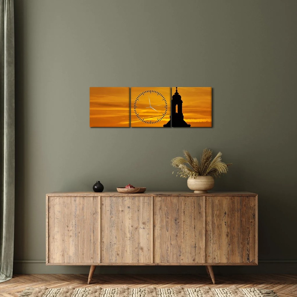 Obraz kostola pri západe slnka (s hodinami) (90x30 cm)