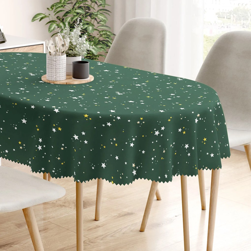 Goldea vianočný oválny teflónový obrus - hviezdičky na zelenej 140 x 180 cm
