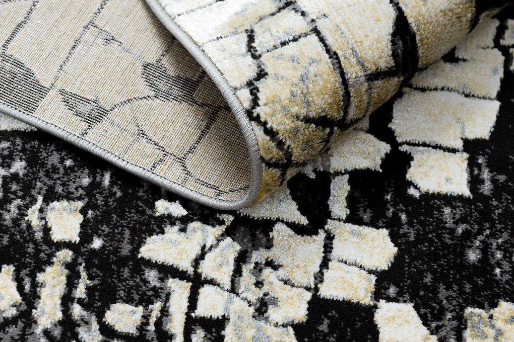 Moderný koberec DE LUXE 2079 Štrukturálny zlatý / sivý