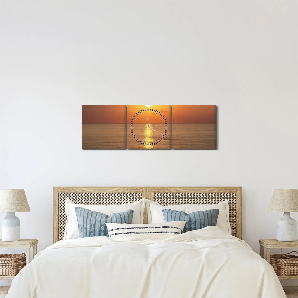 Obraz - Západ slnka nad oceánom (s hodinami) (90x30 cm)