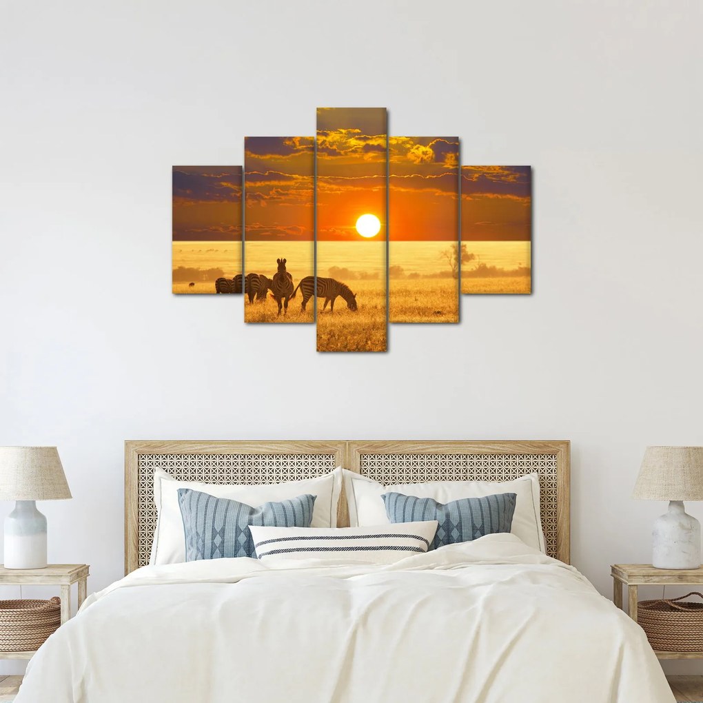 Obraz - Zebry so západom slnka (150x105 cm)