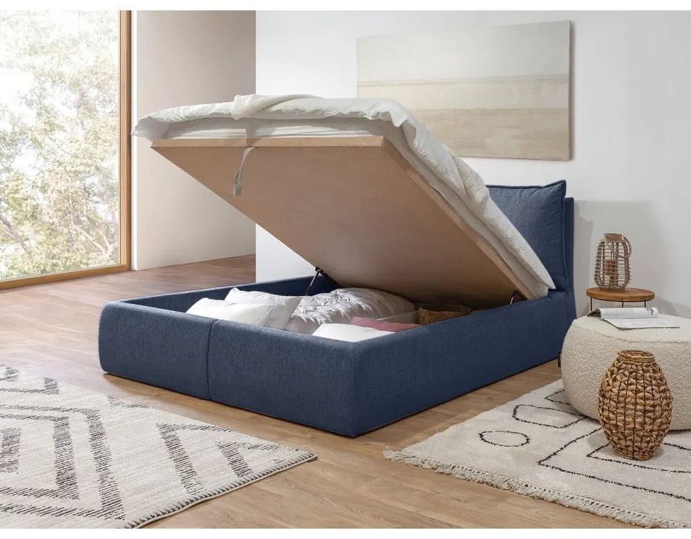 Tmavomodrá čalúnená dvojlôžková posteľ s úložným priestorom a roštom 180x200 cm Garancia – Bobochic Paris