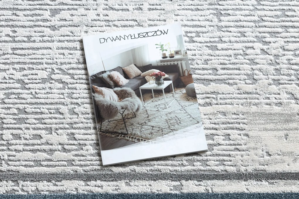 Koberec TULS 51242 s rámikom, slonovinová modrá