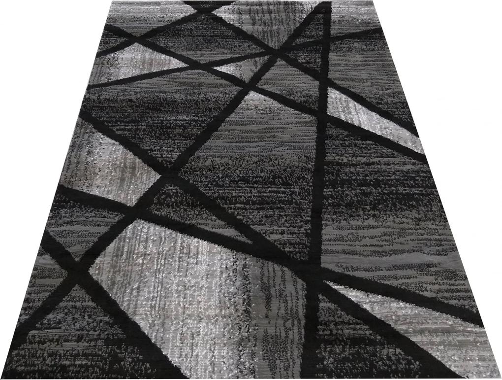 Moderný sivo čierny koberec s abstraktným vzorom