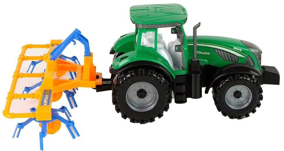 Lean Toys Zelený traktor s hrabľami na seno – trecí pohon