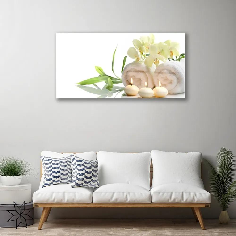 Skleneny obraz Kúpele uteráky sviece orchidea 125x50 cm