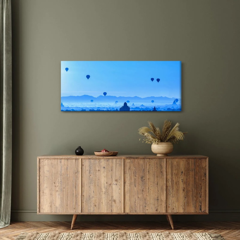Obraz - Balóny nad krajinou (120x50 cm)