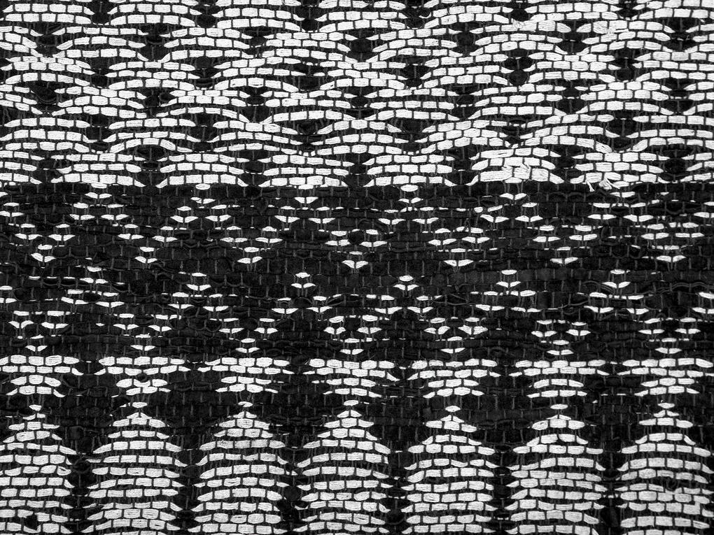 Kožený koberec 80 x 150 cm čierna/béžová SOKUN Beliani