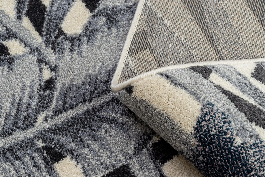 Koberec HEOS 78540 krémovo / modrý LISTY DŽUNGLE