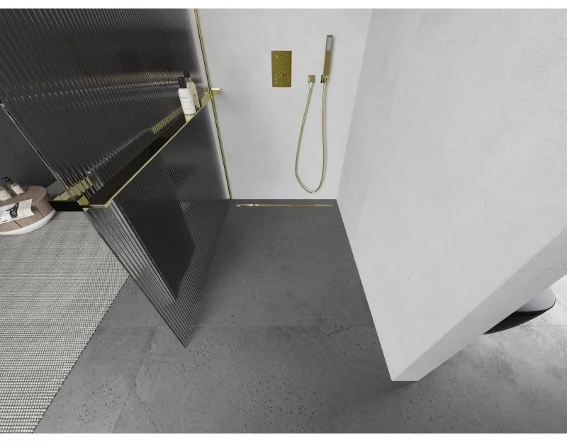 Mexen Kioto+ L, sprchová zástena Walk-In s poličkou a vešiakom 110 x 200 cm, 8mm sklo s rebrovým vzorom, zlatý lesklý profil,800-110-123-50-09