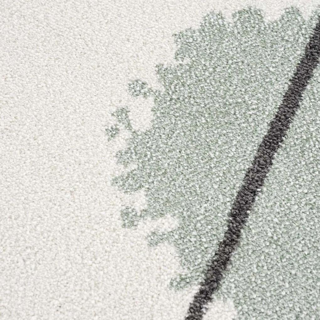 Krémový detský okrúhly koberec so zelenou machuľou