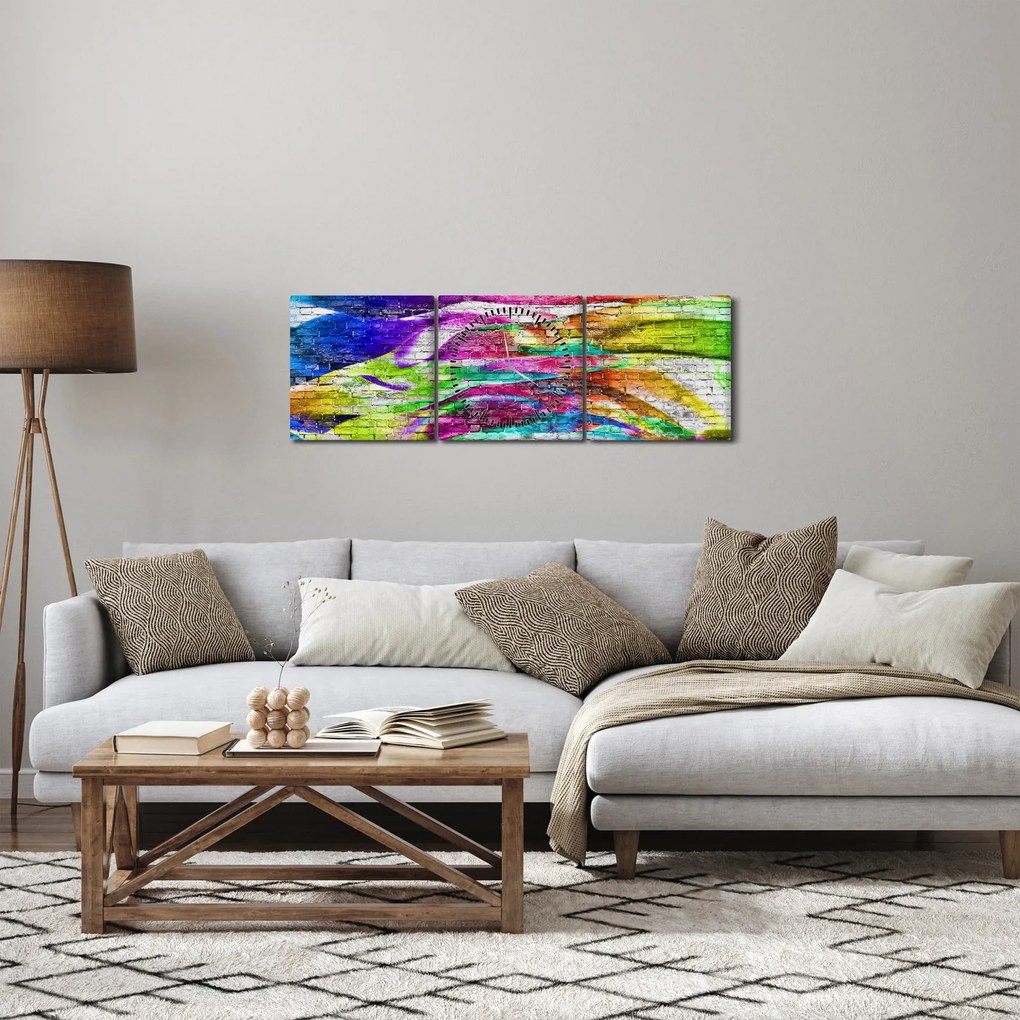 Obraz - Tehlový múr s farebnými plameňmi (s hodinami) (90x30 cm)