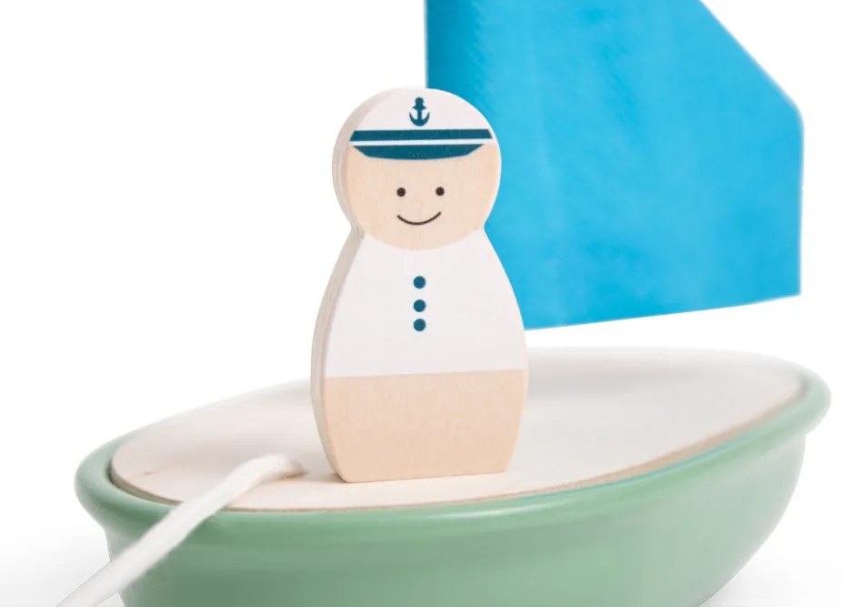 Drevená plachetnica s kapitánom