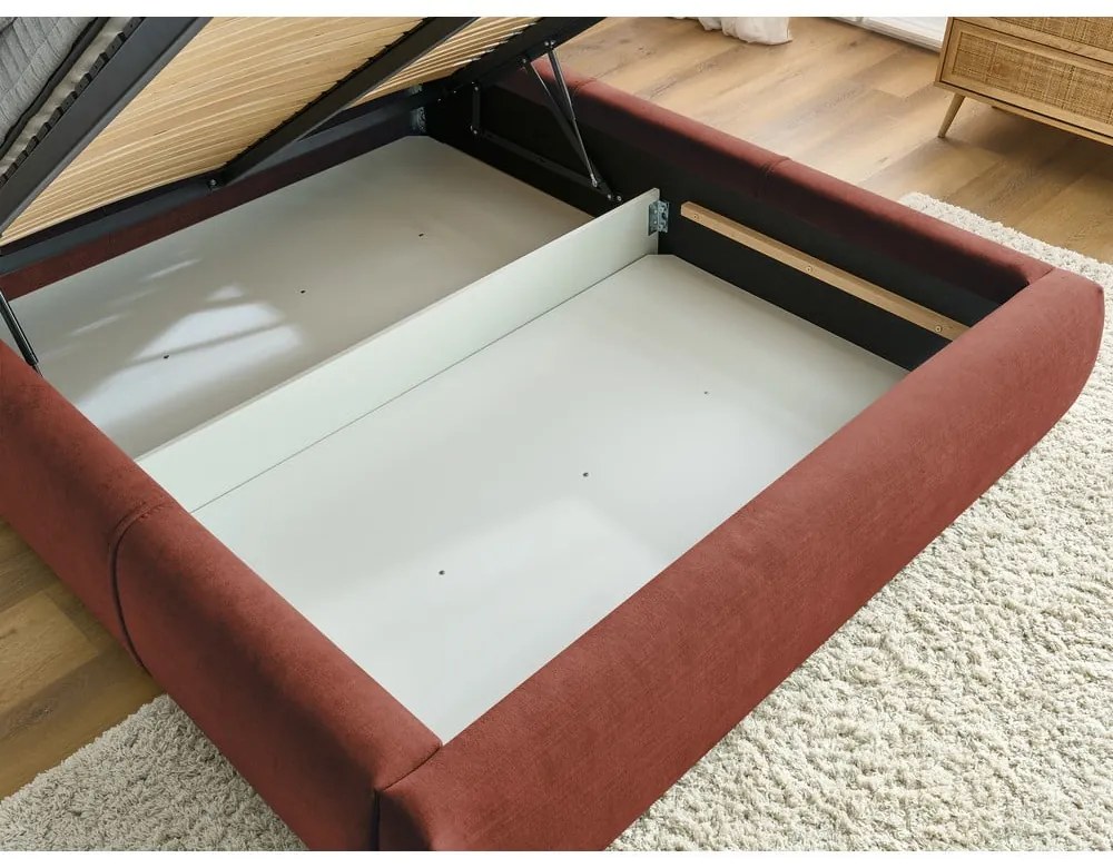 Oranžová čalúnená dvojlôžková posteľ s úložným priestorom s roštom 160x200 cm Vernon – Bobochic Paris