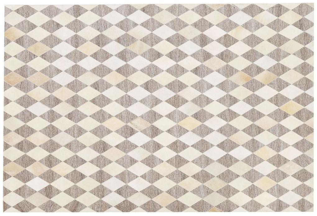 Kožený koberec 140 x 200 cm béžová/hnedá SESLICE Beliani